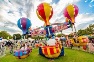 Photography of colourful amusement park ride at knox fest. 