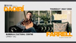 Poster for Daoirí Farrell's Burrinja gig. White boarder. Black & orange writing. Photo of Daoirí Farrell sitting on a couch holding a traditional Irish stringed instrument in the middle of poster. 