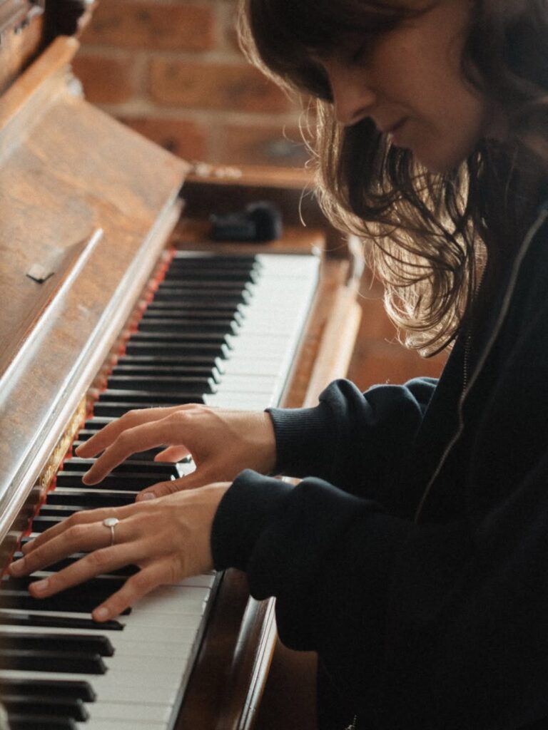 Colour photo of Tig playing piano.
